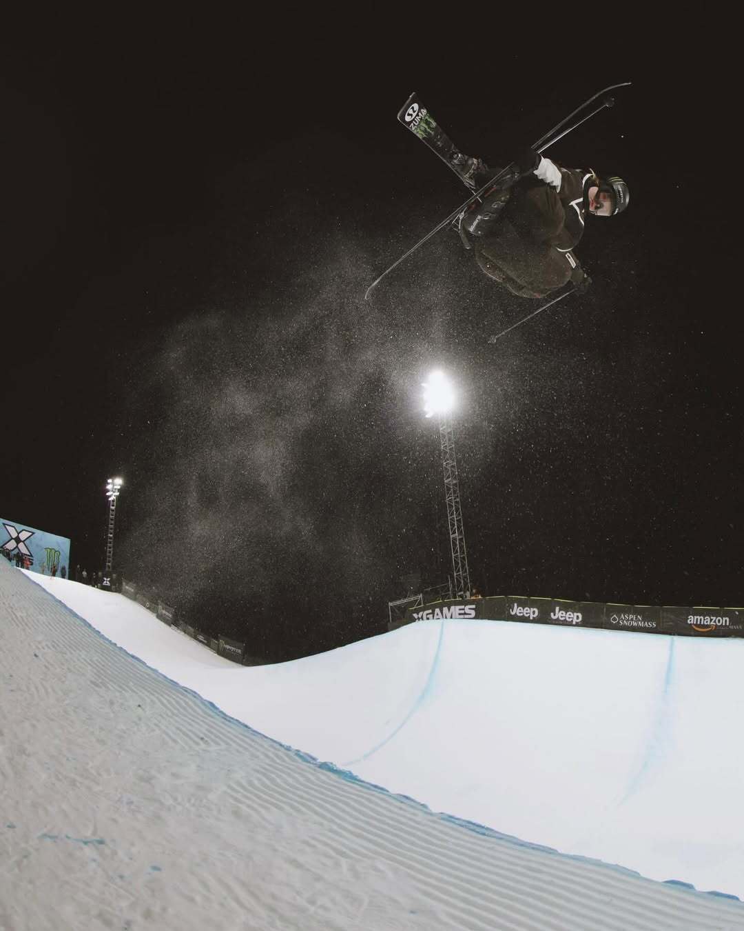 Cassie Sharpe, X Games Aspen athlete, executing a freestyle ski stunt during competition