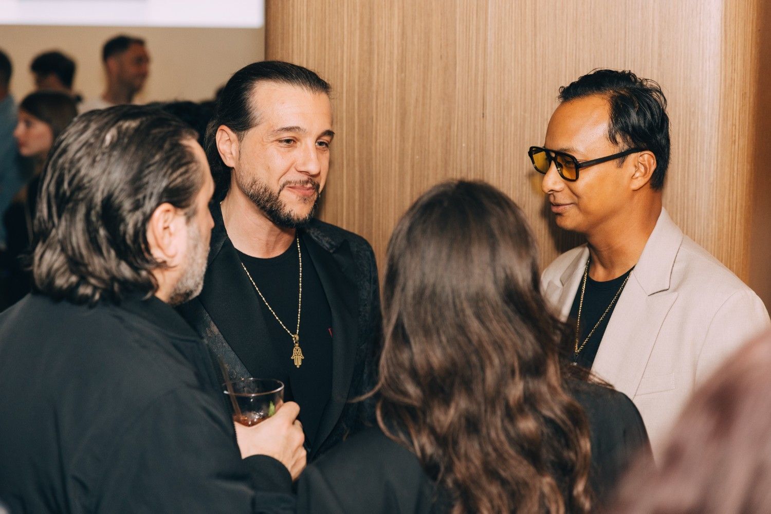 Image of CEO Karim S. Leduc chatting with guests at the Rebrand Launch Event, in the Vogue Hotel, Montreal.