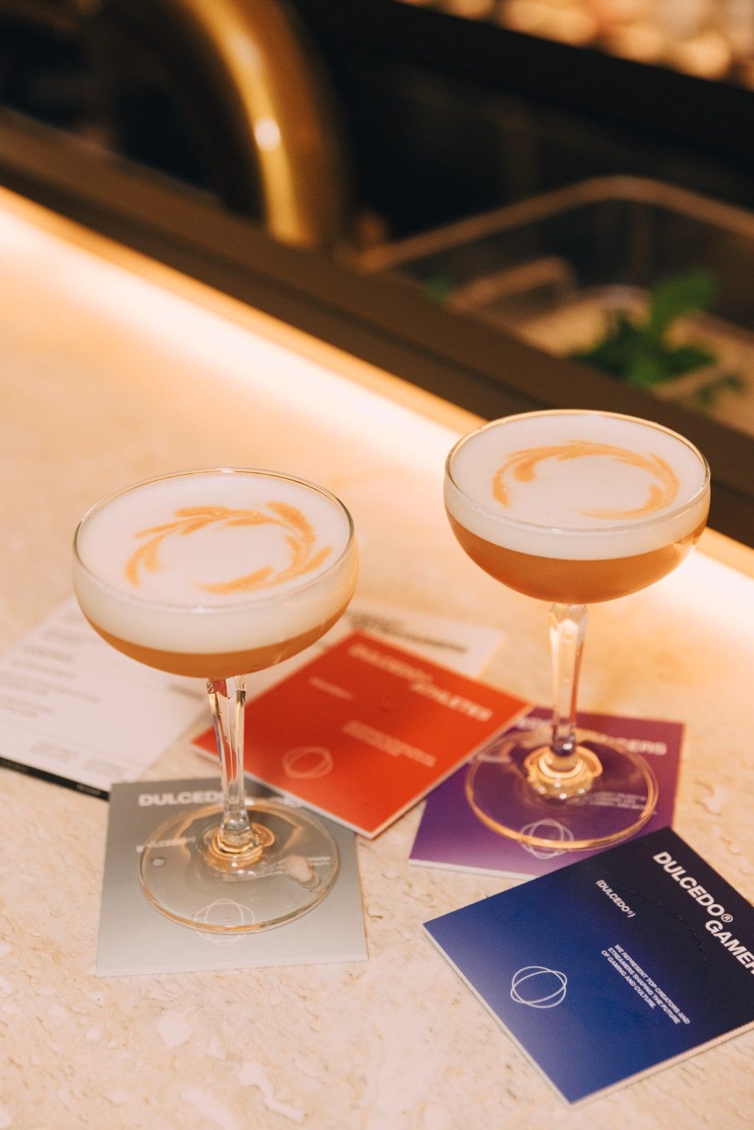 Image of Cocktails at Launch Event on Dulcedo-branded coasters.