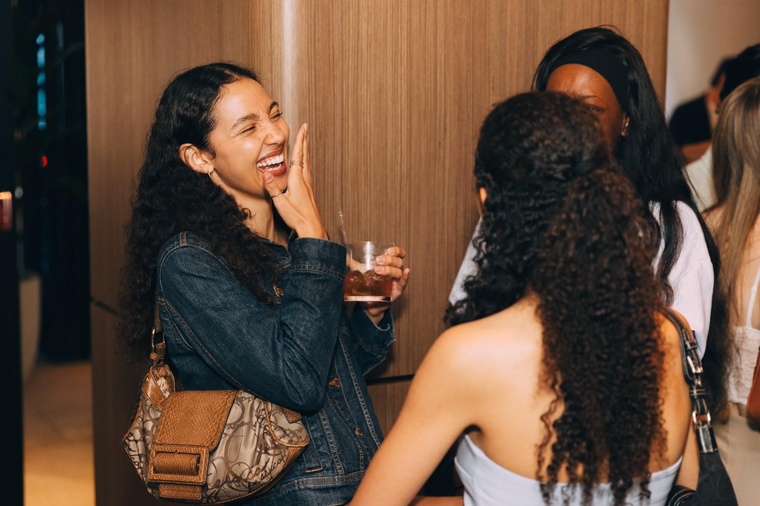 Image of group socializing at the launch event.