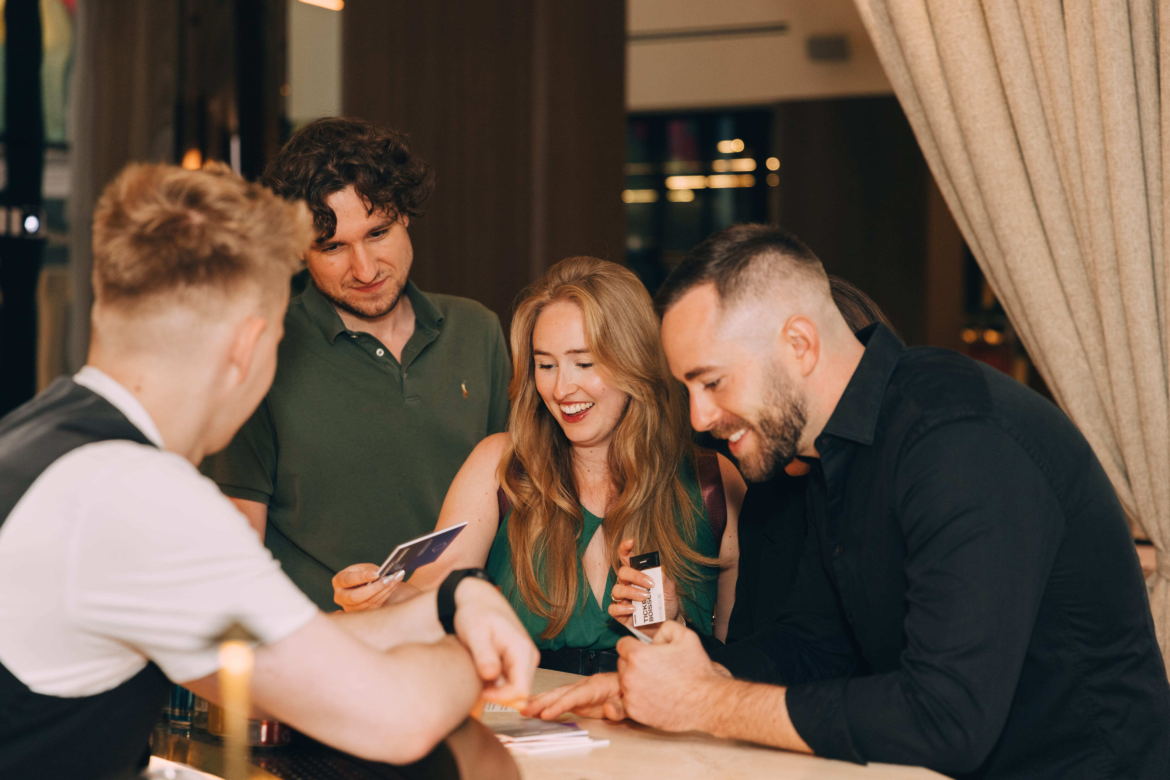 Image of Staff at the bar, look at the custom menu and coasters at the Launch Event.