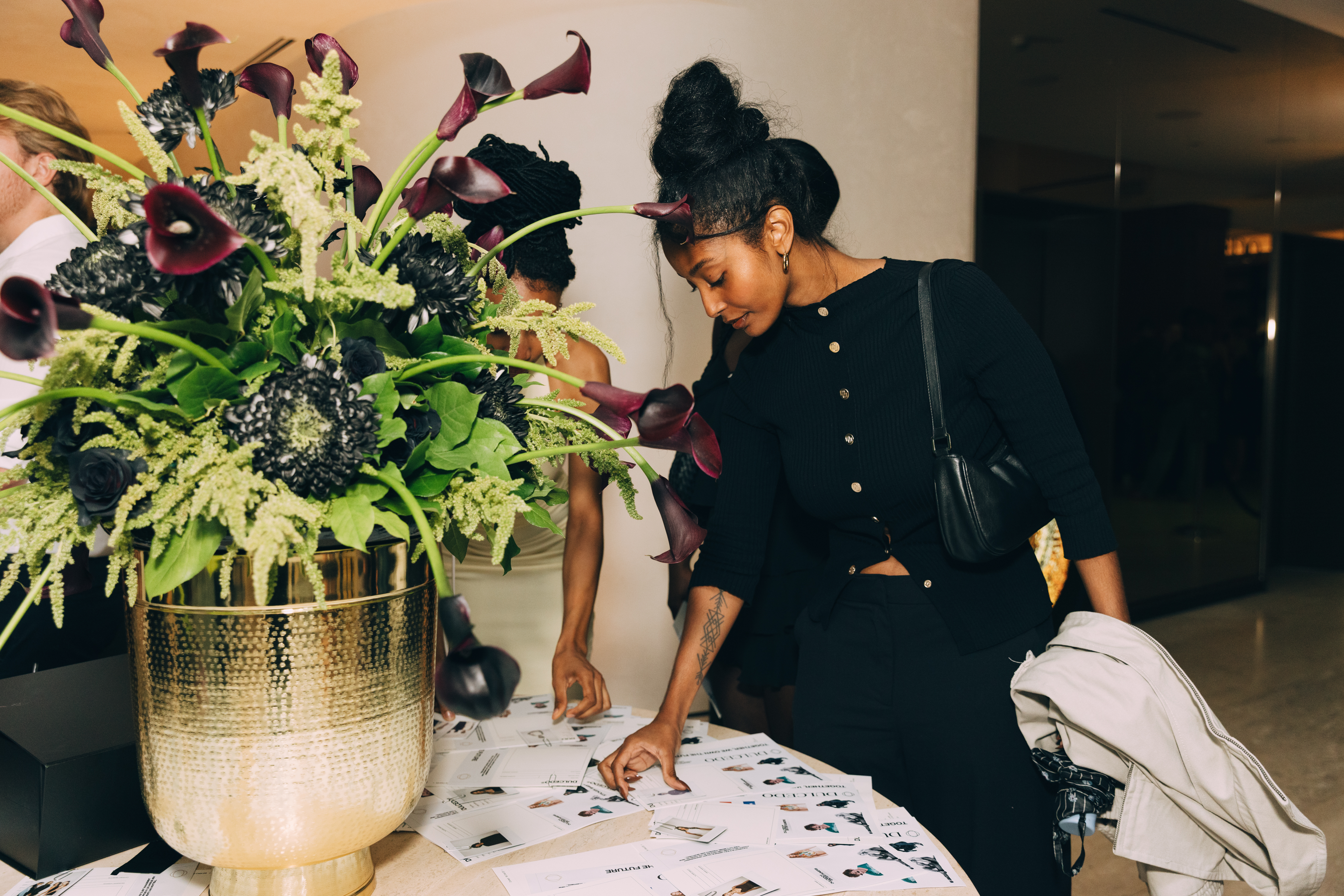 Shan at polaroid table at the launch party
