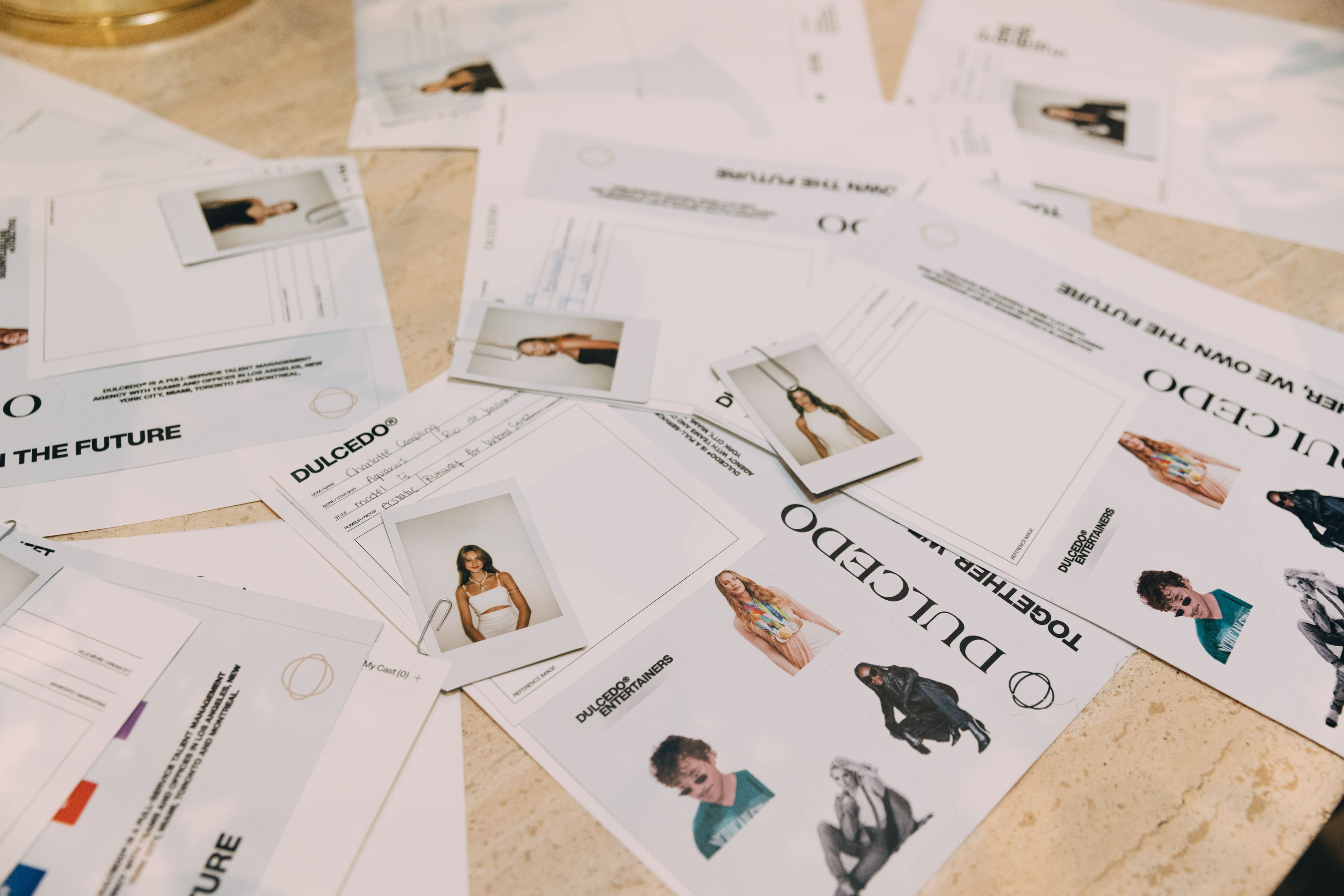 Image of Polaroids as model comp cards at the launch event.