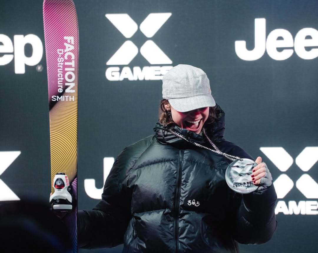 Naomi Urness, X Games Aspen athlete, holding her skis and silver medal following her slopestyle performance